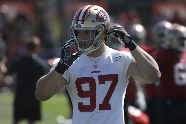 San Francisco 49ers' Nick Bosa adjusts his helmet at the team's NFL football training camp in Santa Clara, Calif., Saturday, July 27, 2019. (AP Photo/Jeff Chiu)