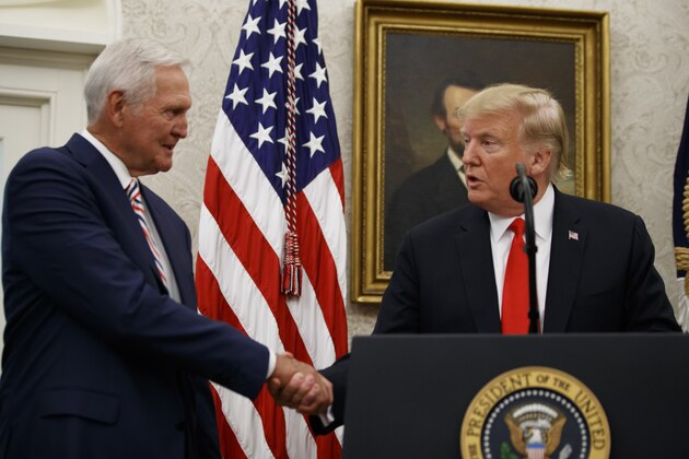 President Donald Trump shakes hands before presenting the Presidential Medal of Freedom to former NBA basketball player and general manager Jerry West, in the Oval Office of the White House, Thursday, Sept. 5, 2019, in Washington. (AP Photo/Alex Brandon)
