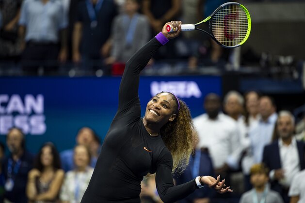 NEW YORK, NEW YORK - SEPTEMBER 05: Serena Williams of the United States hits autographed balls into the crowd after her victory over Elina Svitolina of Ukraine at Arthur Ashe Stadium at the USTA Billie Jean King National Tennis Center on September 05, 2019 in New York City. (Photo by TPN/Getty Images)
