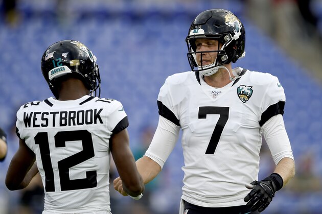 Jacksonville Jaguars wide receiver Dede Westbrook (12) talks to quarterback Nick Foles (7) prior to an NFL football preseason game against the Baltimore Ravens, Thursday, Aug. 8, 2019, in Baltimore. (AP Photo/Gail Burton)