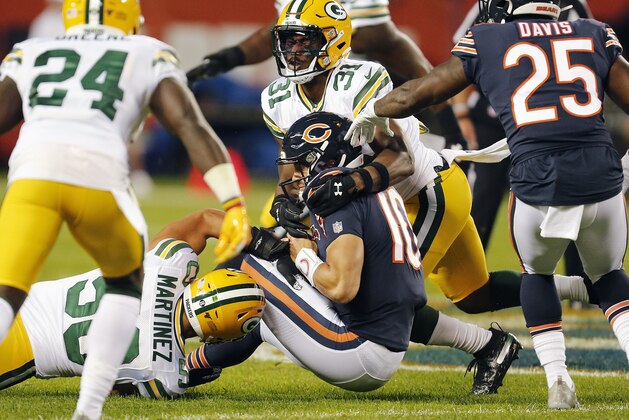 CHICAGO, ILLINOIS - SEPTEMBER 05: Mitchell Trubisky #10 of the Chicago Bears was brought down by Blake Martinez #50 and Adrian Amos #31 of the Green Bay Packers during the first quarter of a game at Soldier Field on September 05, 2019 in Chicago, Illinois. (Photo by Nuccio DiNuzzo/Getty Images)