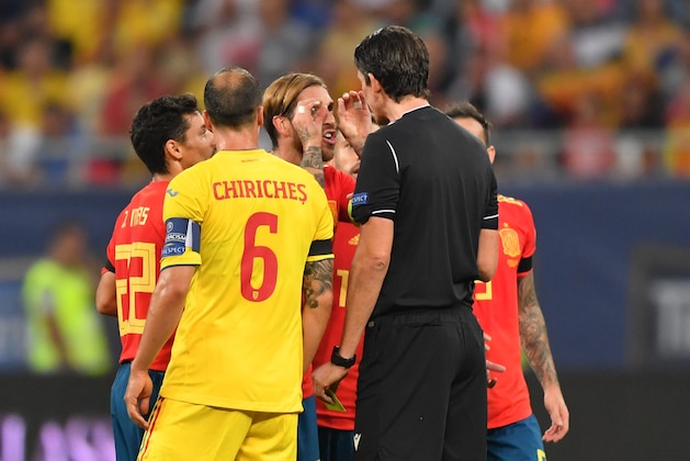 Sergio Ramos (C) of Spain reacts to the referee as he received yellow card after he scored 1-0 against Romania during the Euro 2020 football qualification match between Romania and Spain in Bucharest, Romania, on September 5, 2019. (Photo by Daniel MIHAILESCU / AFP)        (Photo credit should read DANIEL MIHAILESCU/AFP/Getty Images)