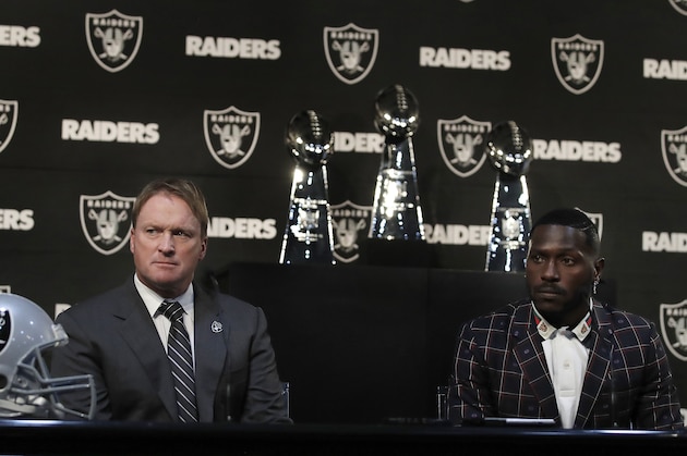 Oakland Raiders coach Jon Gruden, left, and wide receiver Antonio Brown listen to questions from the media during an NFL football news conference, Wednesday, March 13, 2019, in Alameda, Calif. (AP Photo/Ben Margot)