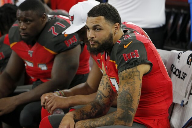Tampa Bay Buccaneers wide receiver Mike Evans (13) sits on the sideline in the second half of a preseason NFL football game against the Dallas Cowboys in Arlington, Texas, Thursday, Aug. 29, 2019. (AP Photo/Michael Ainsworth)