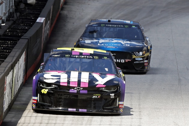Driver Jimmie Johnson (48) leads Clint Bowyer down the back straight during practice for a NASCAR Cup Series auto race, Friday, Aug. 16, 2019, in Bristol, Tenn. (AP Photo/Wade Payne)