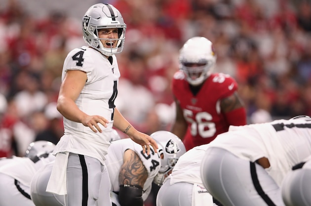 GLENDALE, ARIZONA - AUGUST 15: Quarterback Derek Carr #4 of the Oakland Raiders prepares to snap the football against the Arizona Cardinals during the first half of the NFL preseason game at State Farm Stadium on August 15, 2019 in Glendale, Arizona. (Photo by Christian Petersen/Getty Images) GLENDALE, ARIZONA - AUGUST 15: Quarterback Derek Carr #4 of the Oakland Raiders prepares to snap the football against the Arizona Cardinals during the first half of the NFL preseason game at State Farm Stadium on August 15, 2019 in Glendale, Arizona. (Photo by Christian Petersen/Getty Images)