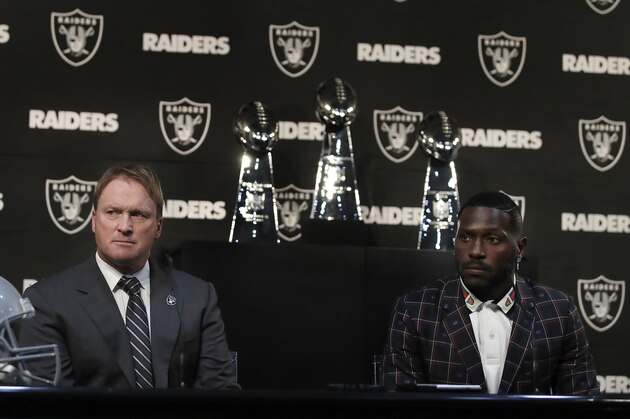 Oakland Raiders coach Jon Gruden, left, and wide receiver Antonio Brown listen to questions from the media during an NFL football news conference, Wednesday, March 13, 2019, in Alameda, Calif. (AP Photo/Ben Margot)