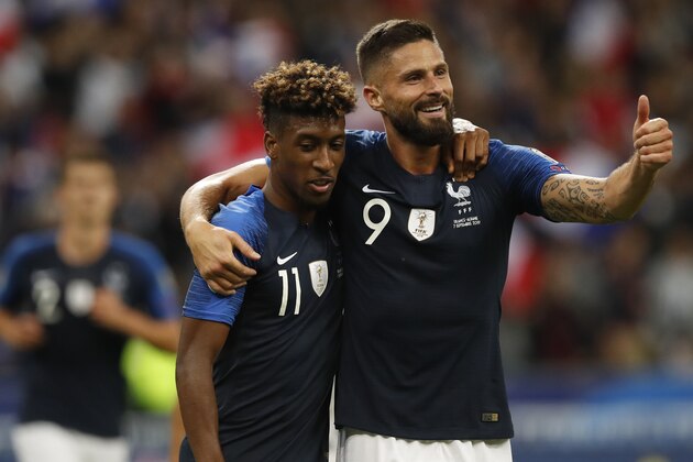 France's Kingsley Coman, left, celebrates his second goal with France's Olivier Giroud during the Euro 2020 group H qualifying soccer match between France and Albania at the Stade de France in Saint Denis, north of Paris, France, Saturday, Sept. 7, 2019. (AP Photo/Christophe Ena)