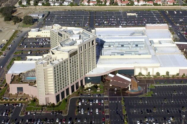 ** FILE **  The Pechanga Resort and Casino on the Pechanga Indian Reservation is shown in this aerial view taken Dec. 5, 2002, near Temecula, Calif.    Gambling revenue at American Indian casinos grew to nearly $23 billion last year, climbing at a rate more than three times faster than traditional gambling operations, with California tribes accounting for nearly a third of the money, according to a private analyst's report. (AP Photo/Ric Francis, File)