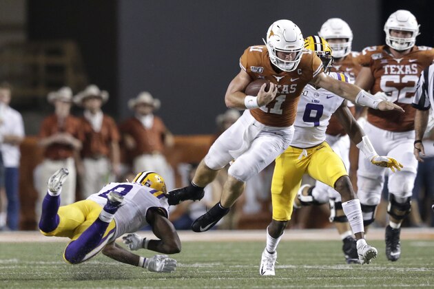AUSTIN, TX - SEPTEMBER 07:  Sam Ehlinger #11 of the Texas Longhorns is tackled by Patrick Queen #8 of the LSU Tigers in the fourth quarter at Darrell K Royal-Texas Memorial Stadium on September 7, 2019 in Austin, Texas.  (Photo by Tim Warner/Getty Images)