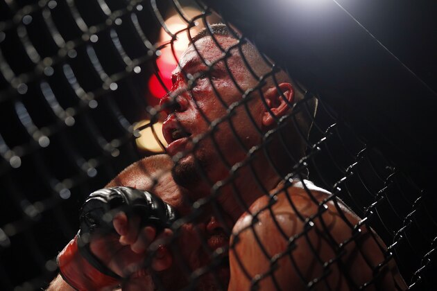 Conor McGregor fights Nate Diaz during their welterweight mixed martial arts bout at UFC 202 on Saturday, Aug. 20, 2016, in Las Vegas. McGregor won by split decision. (AP Photo/Isaac Brekken)