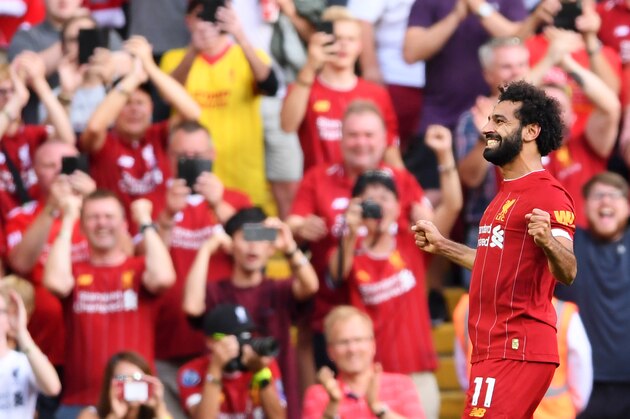 LIVERPOOL, ENGLAND - AUGUST 24: Mohamed Salah of Liverpool celebrates after scoring his team's third goal during the Premier League match between Liverpool FC and Arsenal FC at Anfield on August 24, 2019 in Liverpool, United Kingdom. (Photo by Laurence Griffiths/Getty Images) LIVERPOOL, ENGLAND - AUGUST 24: Mohamed Salah of Liverpool celebrates after scoring his team's third goal during the Premier League match between Liverpool FC and Arsenal FC at Anfield on August 24, 2019 in Liverpool, United Kingdom. (Photo by Laurence Griffiths/Getty Images)