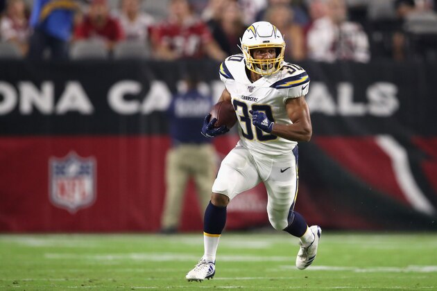 GLENDALE, ARIZONA - AUGUST 08:  Running back Austin Ekeler #30 of the Los Angeles Chargers rushes the football against the Arizona Cardinals during the NFL preseason game at State Farm Stadium on August 08, 2019 in Glendale, Arizona. The Cardinals defeated the Chargers 17-13.  (Photo by Christian Petersen/Getty Images)