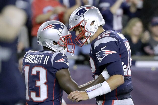 New England Patriots quarterback Tom Brady, right, celebrates his touchdown pass to Phillip Dorsett, left, in the first half an NFL football game against the Pittsburgh Steelers, Sunday, Sept. 8, 2019, in Foxborough, Mass. (AP Photo/Steven Senne)