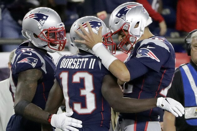 New England Patriots quarterback Tom Brady, right, celebrates his touchdown pass to Phillip Dorsett, center, in the second half of an NFL football game against the Pittsburgh Steelers, Sunday, Sept. 8, 2019, in Foxborough, Mass. (AP Photo/Steven Senne)