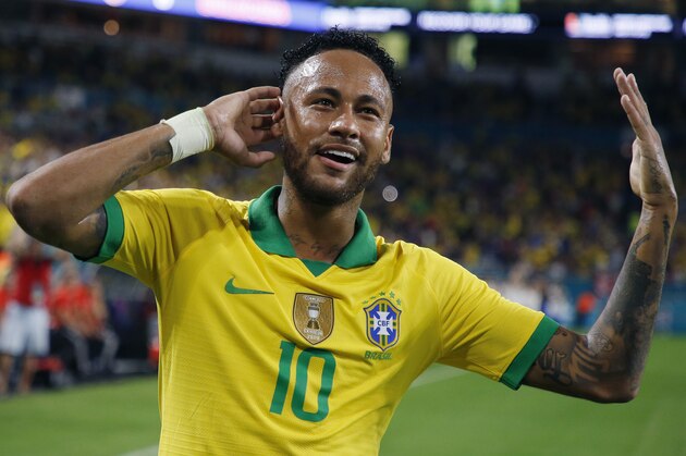 TOPSHOT - Brazil's foward Neymar Jr. celebrates after scoring against Colombia during their international friendly football match between Brazil and Colombia at Hard Rock Stadium in Miami, Florida, on September 6, 2019. (Photo by RHONA WISE / AFP)        (Photo credit should read RHONA WISE/AFP/Getty Images)