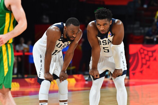 SHENZHEN, CHINA - SEPTEMBER 9: Kemba Walker #15 and Donovan Mitchell #5 of the USA Basketball Men's National Team chats against Team Brazil during the 2019 FIBA World Cup Classification Round at the Shenzhen Bay Sports Center on September 9, 2019 in Shenzhen, China.  NOTE TO USER: User expressly acknowledges and agrees that, by downloading and/or using this Photograph, user is consenting to the terms and conditions of the Getty Images License Agreement. Mandatory Copyright Notice: Copyright 2019 NBAE (Photo by Jesse D. Garrabrant/NBAE via Getty Images)