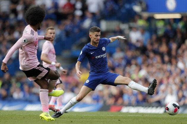 Chelsea's Jorginho tries to block a shot from Leicester's Hamza Choudhury, left, during the English Premier League soccer match between Chelsea and Leicester City at Stamford Bridge stadium in London, Sunday, Aug. 18, 2019. (AP Photo/Frank Augstein)