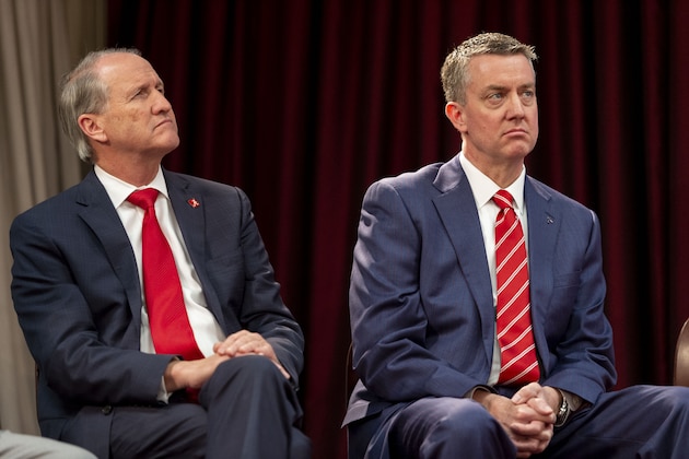 University of Alabama president Stuart R. Bell, left, and Alabama athletic director Greg Byrne listen as Nate Oats speaks after being introduced as the new college basketball coach for the University of Alabama, Thursday, March 28, 2019, in Tuscaloosa, Ala. (AP Photo/Vasha Hunt)