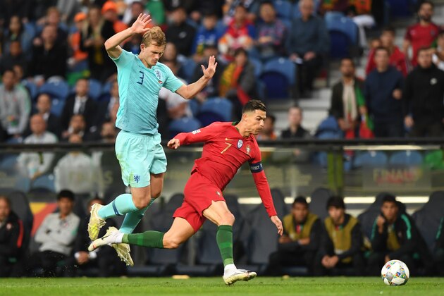 Netherlands' defender Matthijs De Ligt (L) vies with Portugal's forward Cristiano Ronaldo during the UEFA Nations League final football match between Portugal and The Netherlands at the Dragao Stadium in Porto on June 9, 2019. (Photo by PATRICIA DE MELO MOREIRA / AFP)        (Photo credit should read PATRICIA DE MELO MOREIRA/AFP/Getty Images)