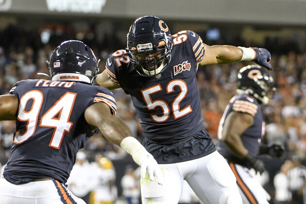 Chicago Bears' Leonard Floyd is congratulated by Khalil Mack after sacking Green Bay Packers' Aaron Rodgers during the first half of an NFL football game Thursday, Sept. 5, 2019, in Chicago. (AP Photo/David Banks)