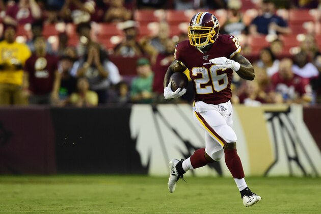 LANDOVER, MD - AUGUST 15: Adrian Peterson #26 of the Washington Redskins rushes with the ball in the first quarter against the Cincinnati Bengals during a preseason game at FedExField on August 15, 2019 in Landover, Maryland. (Photo by Patrick McDermott/Getty Images)