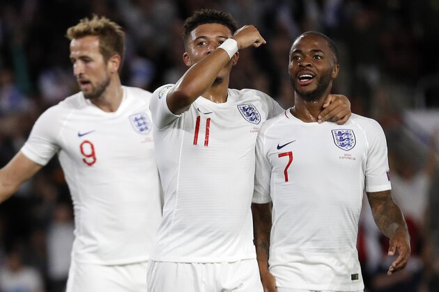 England's midfielder Jadon Sancho (C) celebrates with England's midfielder Raheem Sterling (R) after scoring his second, and the team's fifth goal during the UEFA Euro 2020 qualifying Group A football match between England and Kosovo at St Mary's stadium in Southampton, southern England on September 10, 2019. (Photo by Adrian DENNIS / AFP) / NOT FOR MARKETING OR ADVERTISING USE / RESTRICTED TO EDITORIAL USE        (Photo credit should read ADRIAN DENNIS/AFP/Getty Images)