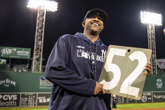 BOSTON, MA - SEPTEMBER 8: CC Sabathia #52 of the New York Yankees reacts as he is presented with a retirement gift from David Price #10 of the Boston Red Sox before a game on September 8, 2019 at Fenway Park in Boston, Massachusetts. (Photo by Billie Weiss/Boston Red Sox/Getty Images)