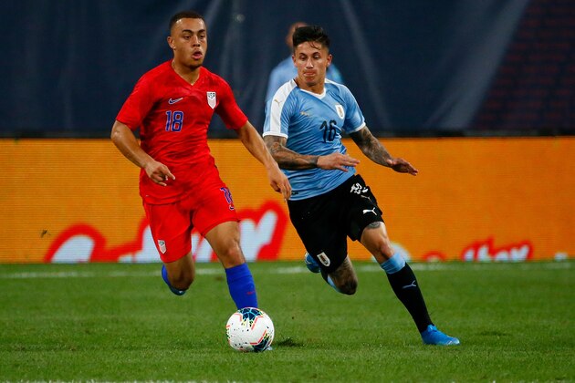 ST LOUIS, MO - SEPTEMBER 10: Sergiño Dest #18 of the United States Mens National Team looks to beat Brian Rodriguez #16 the Uruguay Men's National Team tot he ball at Busch Stadium on September 10, 2019 in St Louis, Missouri. (Photo by Dilip Vishwanat/Getty Images)