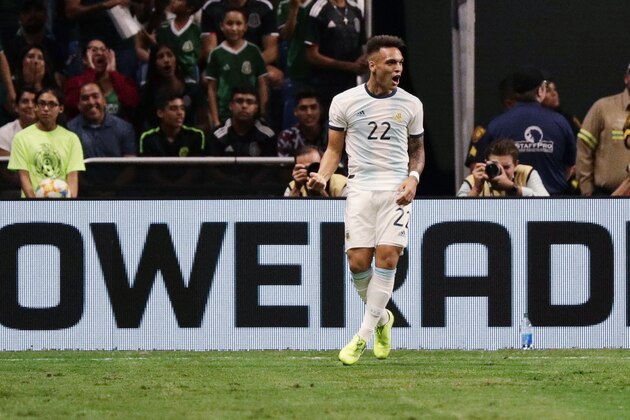 Argentina's Lautaro Martinez (22) celebrates after scoring a goal against Mexico during the first half of an international friendly soccer match Tuesday, Sept. 10, 2019, in San Antonio. (AP Photo/Eric Gay)