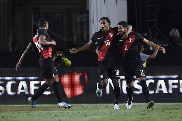 LOS ANGELES, CALIFORNIA - SEPTEMBER 10: Christofer Gonzales #16 and André Carrillo #18 celebrate the goal of Luis Abram #2 of Peru in the 2019 International Champions Cup match against Brazil on September 10, 2019 in Los Angeles, California. (Photo by Kevork Djansezian/Getty Images)