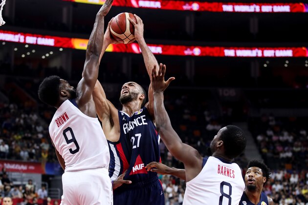 DONGGUAN, CHINA - SEPTEMBER 11: #27 Rudy Gobert  of France shots as #9 Jaylen Brown of USA defends during the quarter final of 2019 FIBA World Cup between USA and France at Dongguan Basketball Center on September 11, 2019 in Dongguan, China. (Photo by Zhizhao Wu/Getty Images)