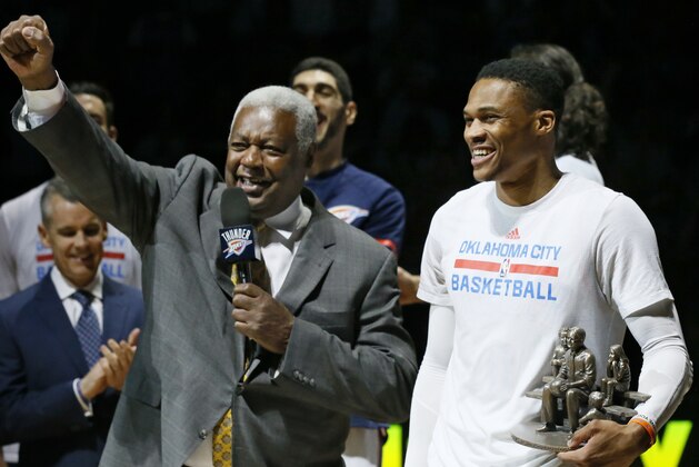 Oklahoma City Thunder guard Russell Westbrook, right, is congratulated by Oscar Robertson, left, on his triple-double record, before an NBA basketball game between the Denver Nuggets and the Thunder in Oklahoma City, Wednesday, April 12, 2017. (AP Photo/Sue Ogrocki)