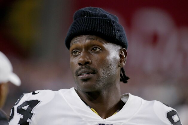 FILE - In this Aug. 15, 2019, file photo, Oakland Raiders wide receiver Antonio Brown watches from the sidelines during the second half of the team's NFL preseason football game against the Arizona Cardinals in Glendale, Ariz. Brown, who was released by the Raiders last week and is now with the New England Patriots, has been accused of rape by a former trainer. Britney Taylor says Brown sexually assaulted her on three occasions, according to a lawsuit filed Tuesday, Sept. 10, in the Southern District of Florida. Brown has denied the allegations (AP Photo/Rick Scuteri, File)