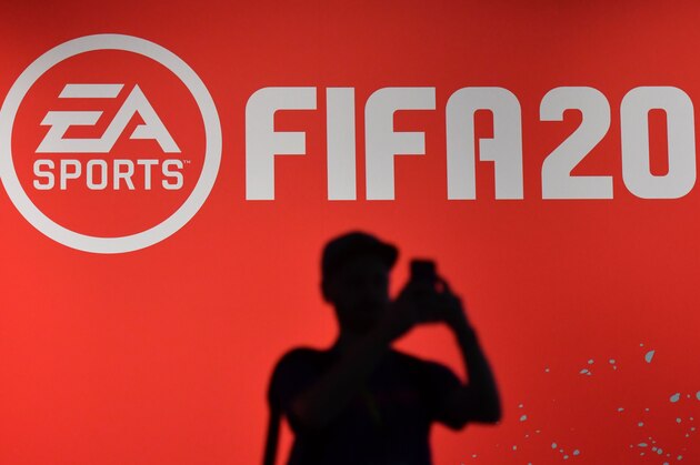 A visitor takes a picture at the booth of the