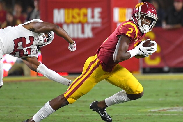 LOS ANGELES, CA - SEPTEMBER 07: Wide receiver Devon Williams #2 of the USC Trojans holds on to pass as he breaks loose from cornerback Obi Eboh #22 of the Stanford Cardinal for a first down in the  first half of the game at the Los Angeles Memorial Coliseum on September 7, 2019 in Los Angeles, California. (Photo by Jayne Kamin-Oncea/Getty Images)
