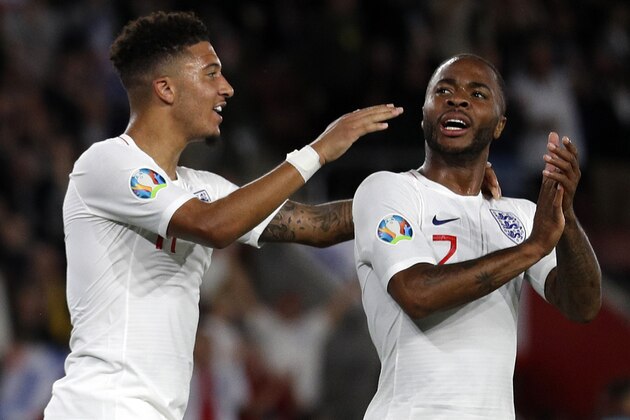 England's midfielder Jadon Sancho (L) celebrates with England's midfielder Raheem Sterling after scoring his second, and the team's fifth goal during the UEFA Euro 2020 qualifying Group A football match between England and Kosovo at St Mary's stadium in Southampton, southern England on September 10, 2019. (Photo by Adrian DENNIS / AFP) / NOT FOR MARKETING OR ADVERTISING USE / RESTRICTED TO EDITORIAL USE (Photo credit should read ADRIAN DENNIS/AFP/Getty Images) England's midfielder Jadon Sancho (L) celebrates with England's midfielder Raheem Sterling after scoring his second, and the team's fifth goal during the UEFA Euro 2020 qualifying Group A football match between England and Kosovo at St Mary's stadium in Southampton, southern England on September 10, 2019. (Photo by Adrian DENNIS / AFP) / NOT FOR MARKETING OR ADVERTISING USE / RESTRICTED TO EDITORIAL USE (Photo credit should read ADRIAN DENNIS/AFP/Getty Images)