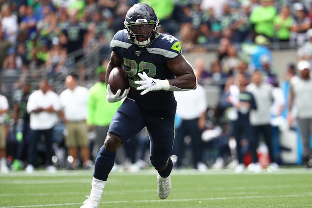 SEATTLE, WASHINGTON - SEPTEMBER 08: Chris Carson #32 of the Seattle Seahawks runs with the ball in the second quarter against the Cincinnati Bengals during their game at CenturyLink Field on September 08, 2019 in Seattle, Washington. (Photo by Abbie Parr/Getty Images)