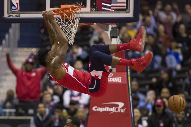Washington Wizards center Dwight Howard dunks the ball during the first half of an NBA basketball game against the Cleveland Cavaliers, Wednesday, Nov. 14, 2018, in Washington. (AP Photo/Alex Brandon)