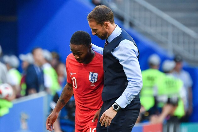 England's coach Gareth Southgate greets England's forward Raheem Sterling (L) during the Russia 2018 World Cup quarter-final football match between Sweden and England at the Samara Arena in Samara on July 7, 2018. (Photo by Yuri CORTEZ / AFP) / RESTRICTED TO EDITORIAL USE - NO MOBILE PUSH ALERTS/DOWNLOADS        (Photo credit should read YURI CORTEZ/AFP/Getty Images)
