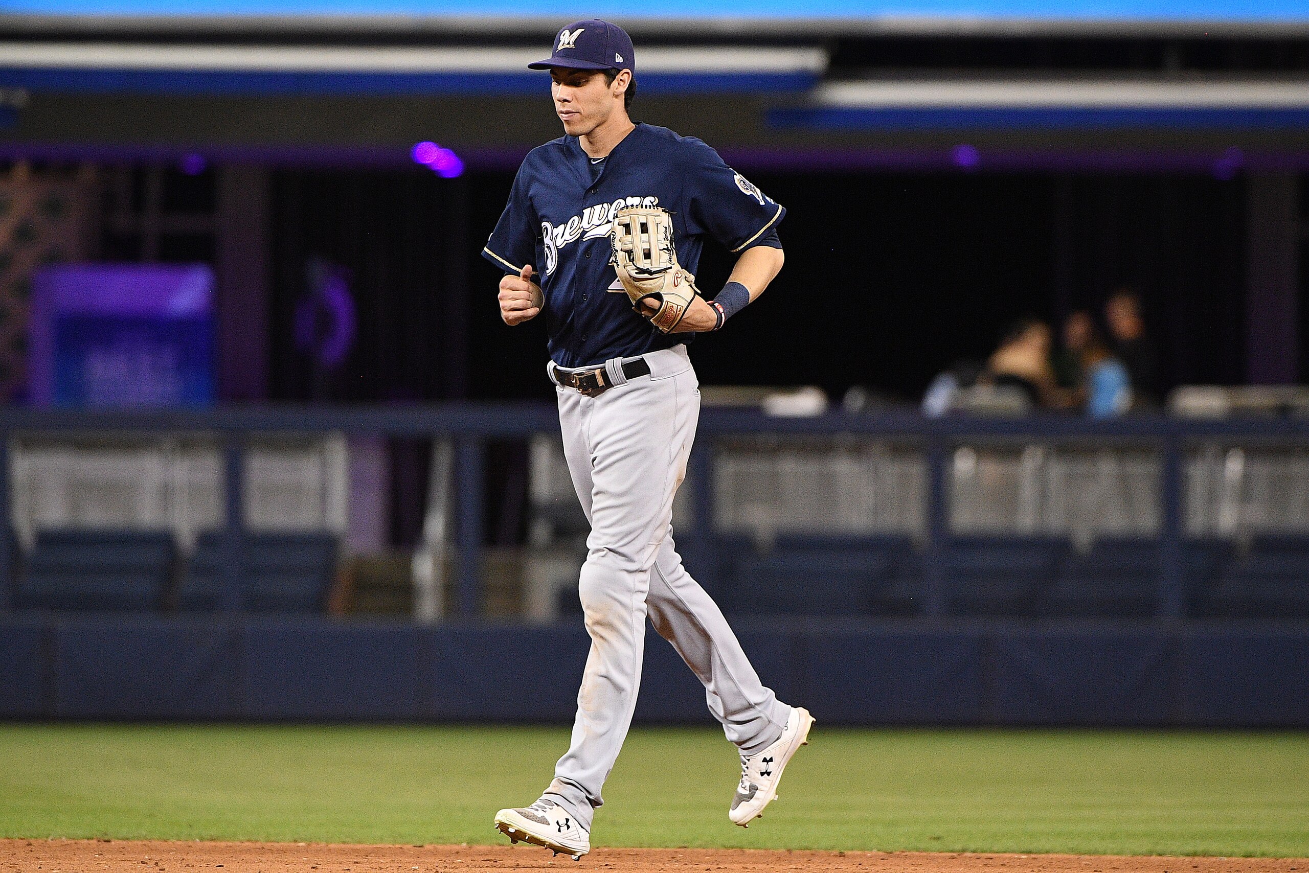 MIAMI, FLORIDA - SEPTEMBER 09: Christian Yelich #22 of the Milwaukee Brewers runs off the field after beating the Miami Marlins at Marlins Park on September 09, 2019 in Miami, Florida. (Photo by Mark Brown/Getty Images)