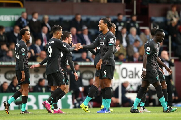 BURNLEY, ENGLAND - AUGUST 31: Roberto Firmino of Liverpool celebrates with teammate Virgil van Dijk after scoring his team's third goal  during the Premier League match between Burnley FC and Liverpool FC at Turf Moor on August 31, 2019 in Burnley, United Kingdom. (Photo by Jan Kruger/Getty Images)