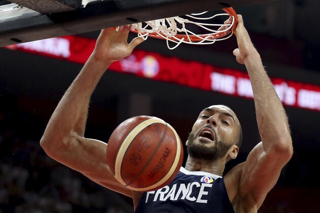 France's Rudy Gobert dunks during a quarterfinal match against United States for the FIBA Basketball World Cup in Dongguan in southern China's Guangdong province on Wednesday, Sept. 11, 2019. France defeated United States 89-79. (AP Photo/Ng Han Guan)