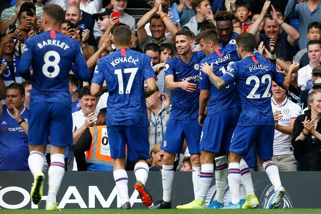 Chelsea's English striker Tammy Abraham (R) celebrates scoring the opening goal during the English Premier League football match between Chelsea and Sheffield United at Stamford Bridge in London on August 31, 2019. (Photo by Ian KINGTON / AFP) / RESTRICTED TO EDITORIAL USE. No use with unauthorized audio, video, data, fixture lists, club/league logos or 'live' services. Online in-match use limited to 120 images. An additional 40 images may be used in extra time. No video emulation. Social media in-match use limited to 120 images. An additional 40 images may be used in extra time. No use in betting publications, games or single club/league/player publications. /         (Photo credit should read IAN KINGTON/AFP/Getty Images)