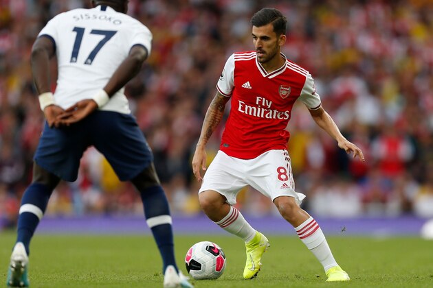 Arsenal's Spanish midfielder Dani Ceballos runs with the ball during the English Premier League football match between Arsenal and Tottenham Hotspur at the Emirates Stadium in London on September 1, 2019. (Photo by Ian KINGTON / IKIMAGES / AFP) / RESTRICTED TO EDITORIAL USE. No use with unauthorized audio, video, data, fixture lists, club/league logos or 'live' services. Online in-match use limited to 45 images, no video emulation. No use in betting, games or single club/league/player publications.        (Photo credit should read IAN KINGTON/AFP/Getty Images)
