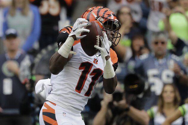 FILE - In this Sept. 8, 2019, file photo, Cincinnati Bengals wide receiver John Ross makes a catch for a touchdown during the first half of an NFL football game against the Seattle Seahawks, in Seattle. After two disappointing seasons cut short by injuries and a missed training camp, Bengals receiver John Ross has his breakout game, one of the most encouraging things for Cincinnati in its opener. (AP Photo/John Froschauer, File)