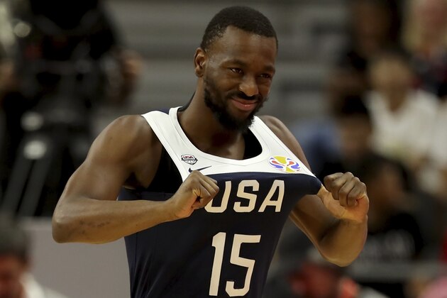 United States' Kemba Walker pulls on his jersey during a consolation playoff game against Serbia for the FIBA Basketball World Cup in Dongguan in southern China's Guangdong province on Thursday, Sept. 12, 2019. The U.S. will leave the World Cup with its worst finish ever in a major international tournament, assured of finishing no better than seventh after falling to Serbia 94-89 in a consolation playoff game on Thursday night. (AP Photo/Ng Han Guan)