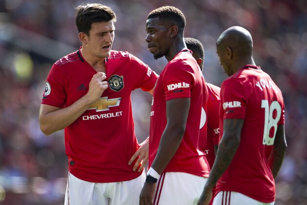 MANCHESTER, ENGLAND - AUGUST 24: Harry Maguire and Paul Pogba of Manchester United during the Premier League match between Manchester United and Crystal Palace at Old Trafford on August 24, 2019 in Manchester, United Kingdom. (Photo by Visionhaus/Getty Images)