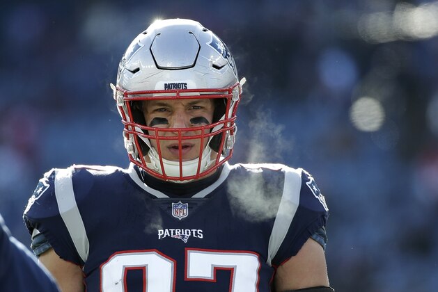 New England Patriots tight end Rob Gronkowski warms up before an NFL divisional playoff football game against the Los Angeles Chargers, Sunday, Jan. 13, 2019, in Foxborough, Mass. (AP Photo/Elise Amendola)