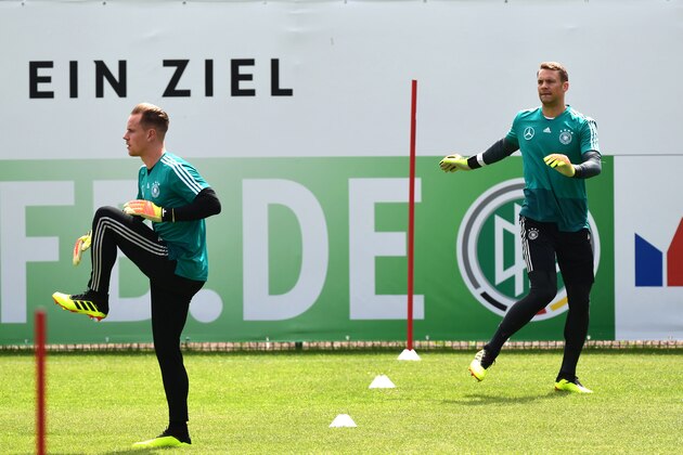 German national football team goalkeeper Marc-Andre ter Stegen (L) and German national football team goalkeeper Manuel Neuer take part in a training session at the Rungghof training center on May 29, 2018 in Girlan, near Bolzano, northern Italy, ahead of the FIFA World Cup 2018 in Russia. - The